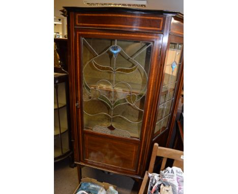 A fine Edwardian mahogany inlaid cabinet, the single glazed door fitted with foliate lead light door on square tapering legs