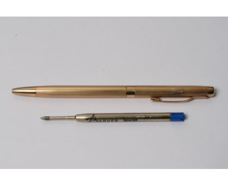 A 9ct gold cased pen with engine turned decoration, makers initials W. M.