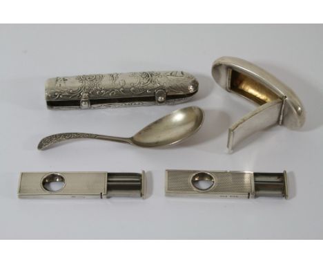 A silver cigar holder decorated with sailing boats  probably continental, two cigar cutters, a silver gilt pill box and a spo