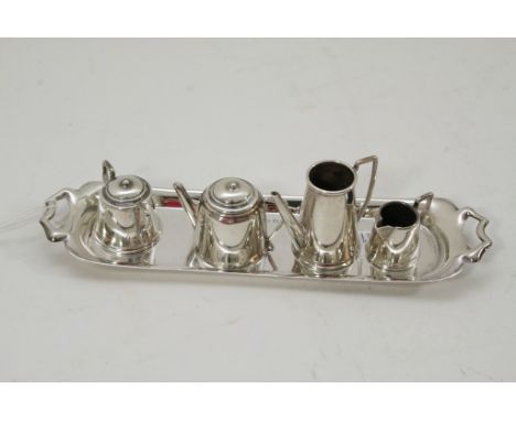 A miniature silver tea and coffee service.