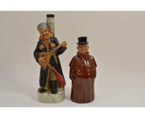 A Cortendorf German ceramic novelty decanter or liquor bottle in the form of a hotel doorman wearing a brown coat with the na