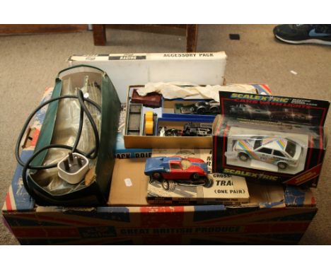 An unboxed Hornby 'Duchess of Montrose' train with another train and carriages plus boxed Airfix model bridges and track