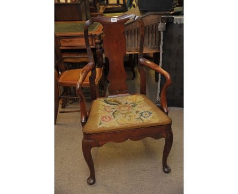 A George III Mahogany arm chair with tapestry seat.