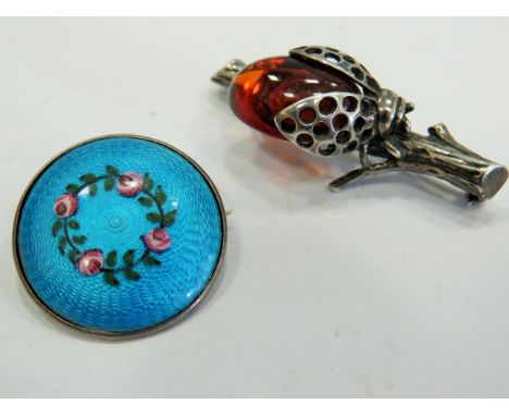 Silver ladybug with Amber body, 35mm long together with an Engine turned Silve and Enamel brooch. See photos. 