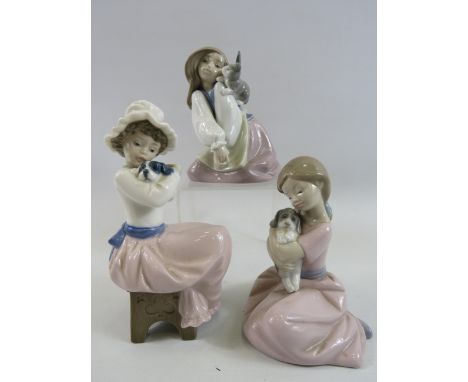 3 Nao figurines of girls with animals.