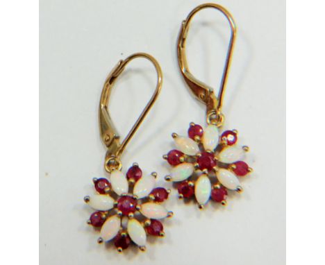 Pair of 9ct Gold Pearl and Ruby set earrings in a flower pattern. Each 25mm drop. Total weight 2.0g