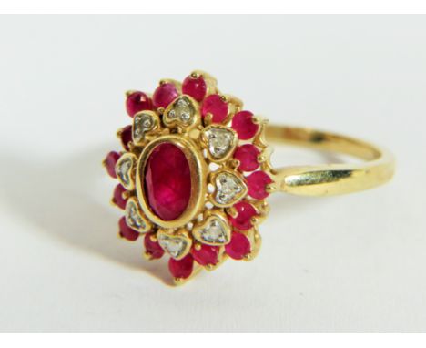 9ct Yellow Gold Diamond and Ruby set Flower pattern ring. Finger size 'P'  3.9g