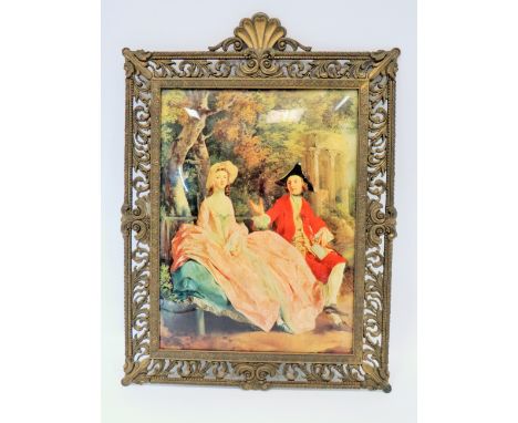 Italian made Crystolium style portrait of renaissance figures.  Beautiful scrolled gilt metal frame which measures 21 x 16 in