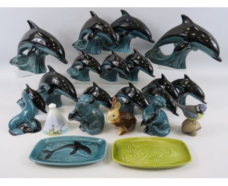 14 Poole pottery dolphins and a selection of various other Poole pottery figurines etc