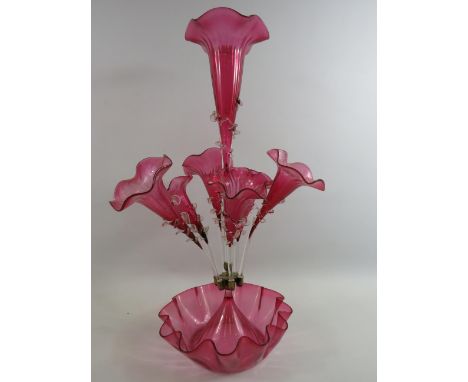 Victorian cranberry glass epergne vase with 7 trumpets, approx 23" tall.