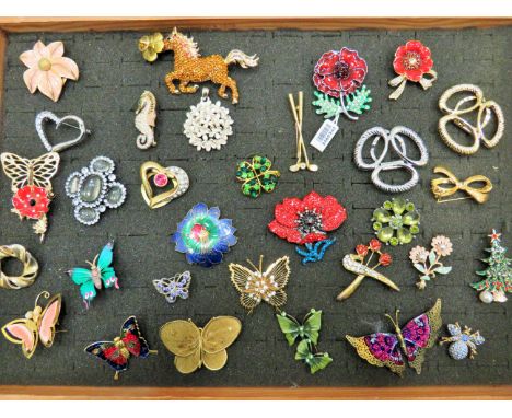 Large Selection of metal and enamel costume brooches. See photos. 