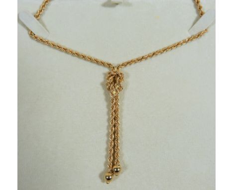 18ct Twist rope neck chain with knot style pendant woven in.  Overall length  22 inches. Total weight 10.8g  Comes with origi