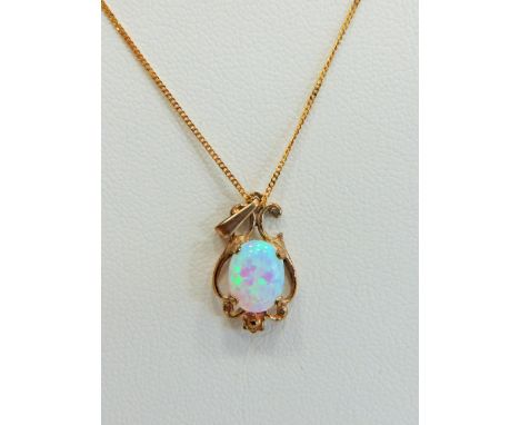 9ct Gold Art Nouveau style pendant set with a high coloured Opal hung on an 18 inch 9ct Chain.  Total weight 2.0g