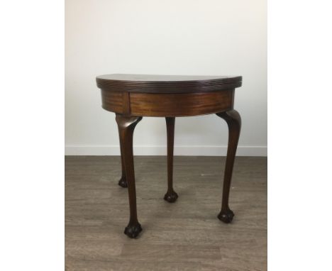 MAHOGANY DEMI-LUNE FOLD OVER CARD TABLE, on cabriole supports to claw and ball feet, 77cm wide