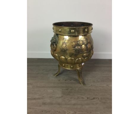 VICTORIAN COPPER PLANTER, of large proportions, brass finish, with lionhead and ring handles and embrossed floral decoration,