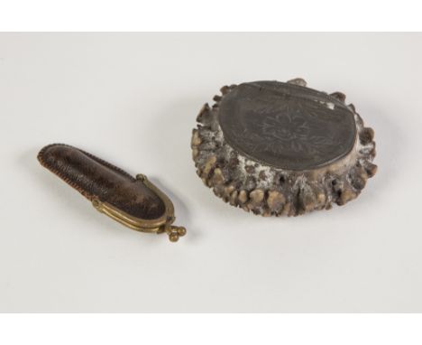 UNUSUAL 19TH CENTURY TABLE SNUFF BOX of oval form the hinged cover foliate engraved and set into the sawn off base of a deer 