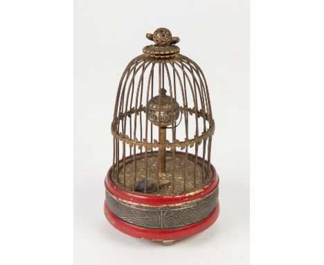 JAPANESE SINGING BIRD CAGE PATTERN NOVELTY CLOCK, of typical form with wire pattern dome topped cage, with revolving sphere a
