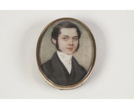 SMALL 19TH CENTURY OVAL PORTRAIT MINIATURE ON IVORY HEAD AND SHOULDERS OF A YOUNG GENTLEMAN with dark hair and side burns, 2 