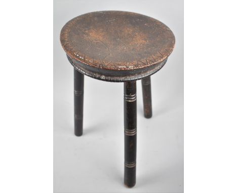 A Vintage Circular Topped Three Legged Stool with Pokerwork Decoration, 26cms Diameter 
