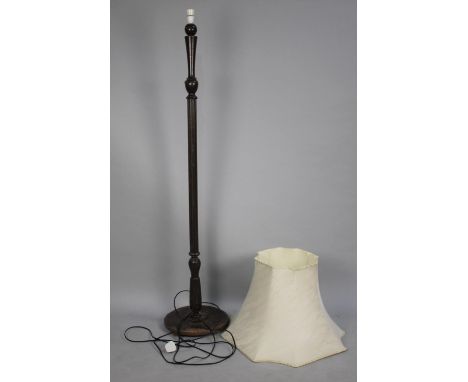 A Mid 20th century Standard Lamp with Turned Reeded Supports 
