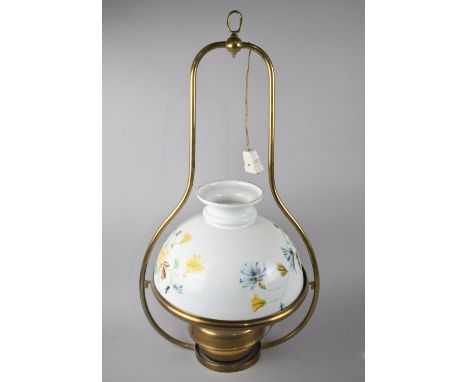 A Mid 20th Century Brass Ceiling Light in the Form of an Oil Lamp, Opaque Glass Shade with Painted Decoration, 79cms High 