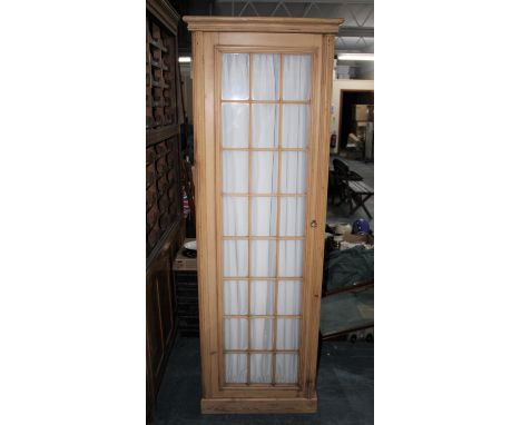 A Vintage Stripped Pine Glazed Wardrobe with Three Graduated Drawers and Hanging Section Over, 64cms Wide and 190cms High 