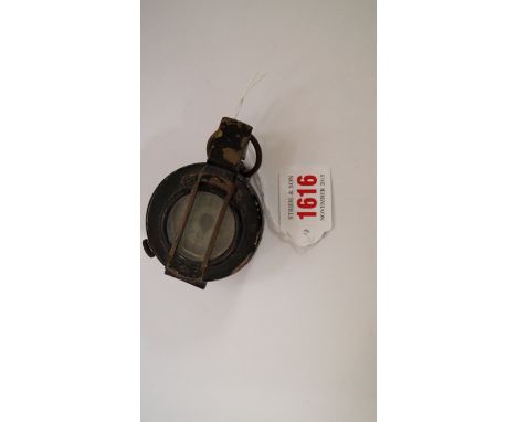 A World War II period military pocket compass, by T.G. Co Ltd, dated 1942 and inscribed MkIII.