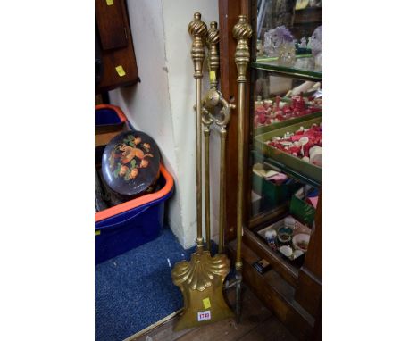 A set of three 19th century brass fire tools.