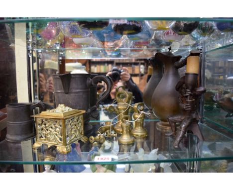 A mixed lot, to include: a brass inkwell; a figural candlestick; a set of brass bell weights; and two pewter tankards. 