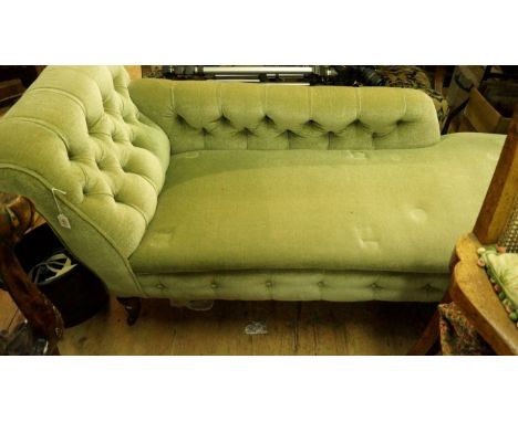 A late Victorian walnut and button upholstered chaise longue.
