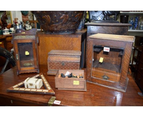 Two early 20th century oak smoker's cabinets; together with a boxwood and ebonized chess set, boxed; a triangular cribbage bo
