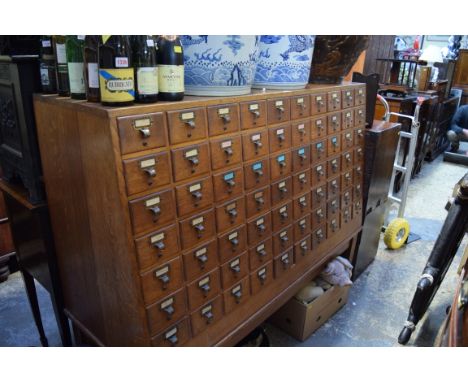 An early 20th century oak Libraco filing chest, of seventy drawers, 161cm wide.  Condition Report: Condition commensurate wit