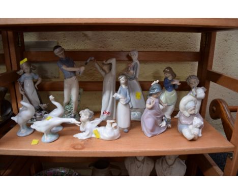 Nine Lladro figures; together with Nao figures and others similar. 