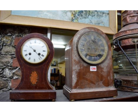 A late 19th century mahogany and inlaid balloon form mantel clock, 29cm high; together with another similar mahogany example.