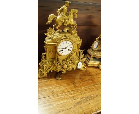 A late 19th century French gilt brass mantel clock, the enamel dial inscribed 'C F Petit, a Paris', 38cm high.