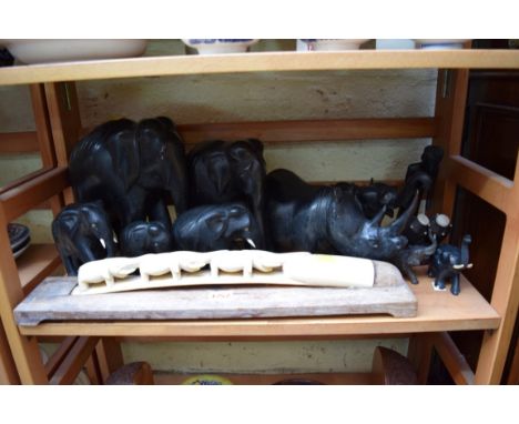 A small quantity of African ebony elephants; together with a similar rhinoceros; and an ivory tusk. 