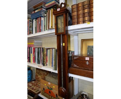 An antique mahogany stick barometer, with printed dial. 