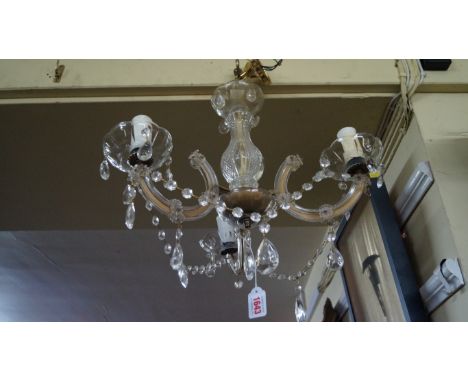 An old glass three branch ceiling light.