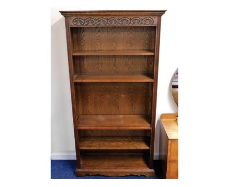 An Old Charm oak bookcase (one set of shelf pins missing), 73.75in high x 39in wide x 13in deep