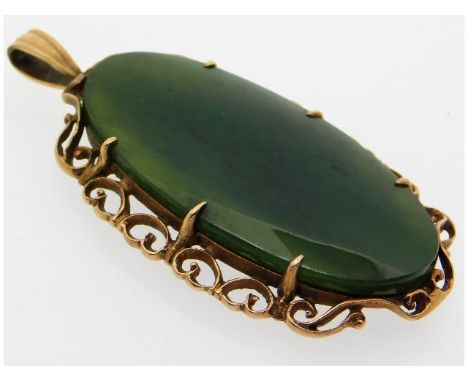 A 9ct gold mounted jade pendant, 53.5mm high, 9.2g