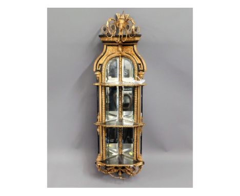 A 19thC. gilt beveled mirrored corner shelf unit with ebonised shelves, some faults to gesso decor, 51in high
