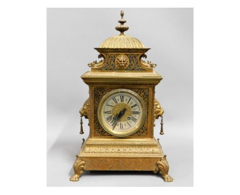 A decorative French brass mantle clock