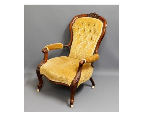 A 19thC. rosewood button back armchair, fault to one arm, 38.5in high to back