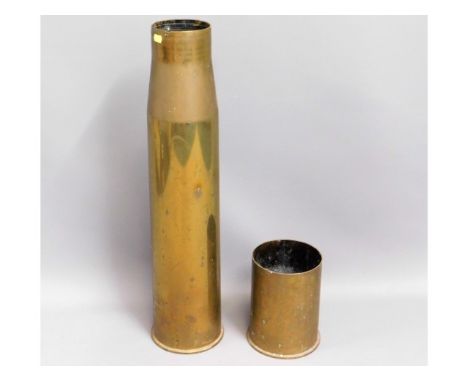 A large brass canon shell stick stand, 27.5in high twinned with one other
