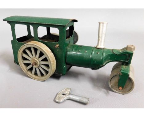 A tin plate clockwork steam roller, working order with key