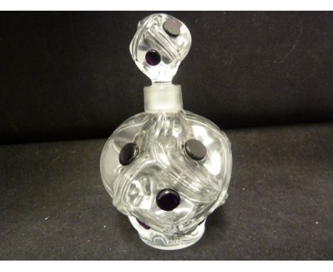 Marie Claude Lalique - a perfume bottle the body of ovoid form with convex compartments the centre applied with amethyst butt