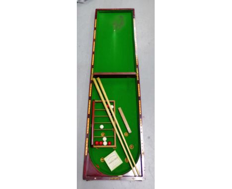 Mahogany cased Bagatelle board with cues and Bonzoline balls etc.