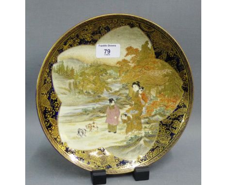Japanese Satsuma plate, finely painted with figures and dogs with a blue and gilt border, signed Mons mark verso, 25cm diamet
