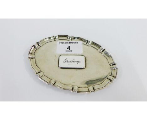 Edwardian silver calling card tray with 'Greetings' white enamel plaque, by Goldsmiths and Silversmiths Company, London 1909,