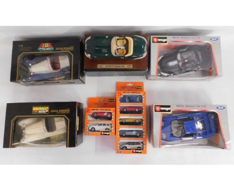 Twelve boxed Burago diecast vehicles including five 1:18 scale